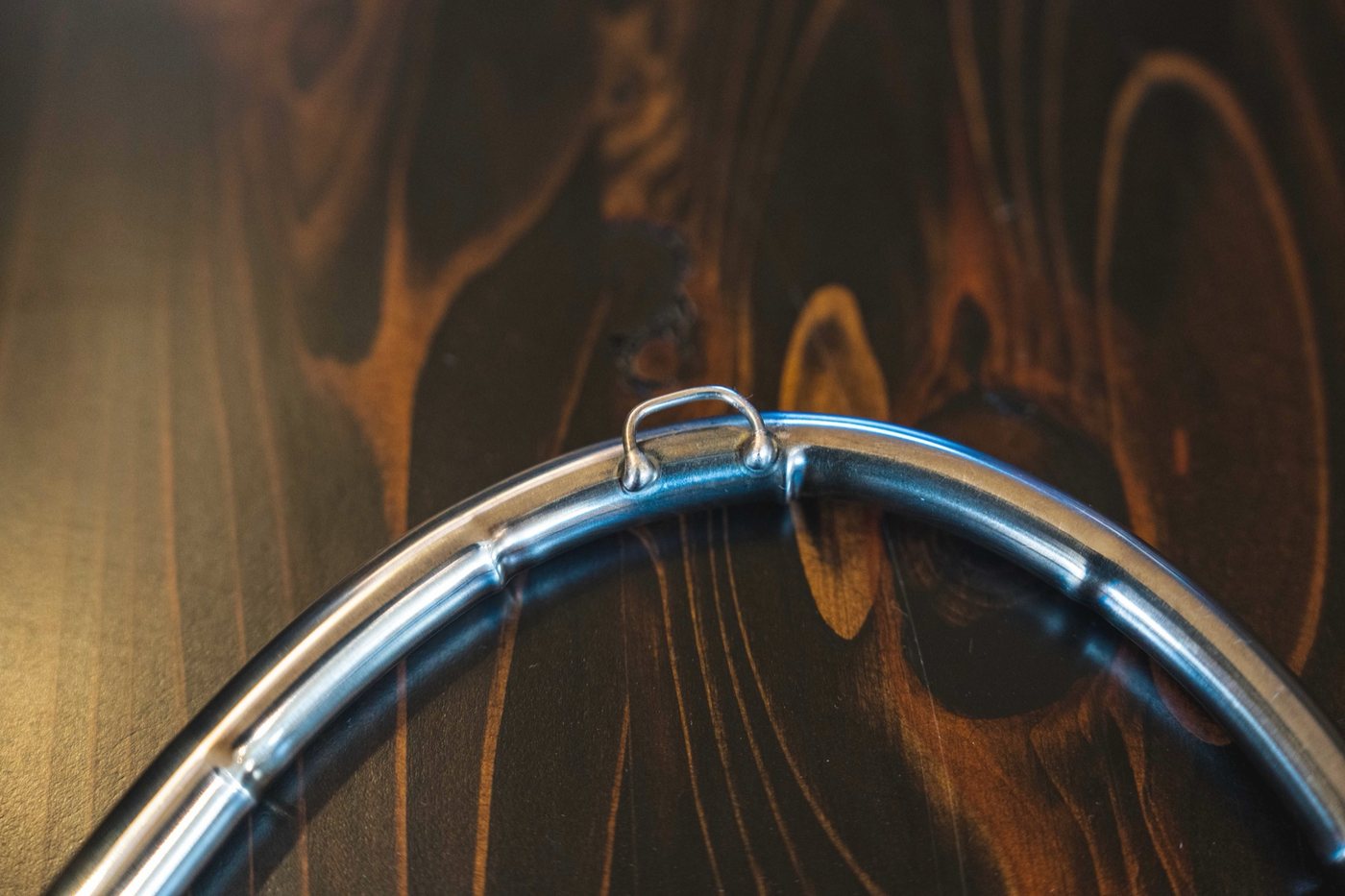 Close-up of the smooth bend in the steel shaft with its hanging loop